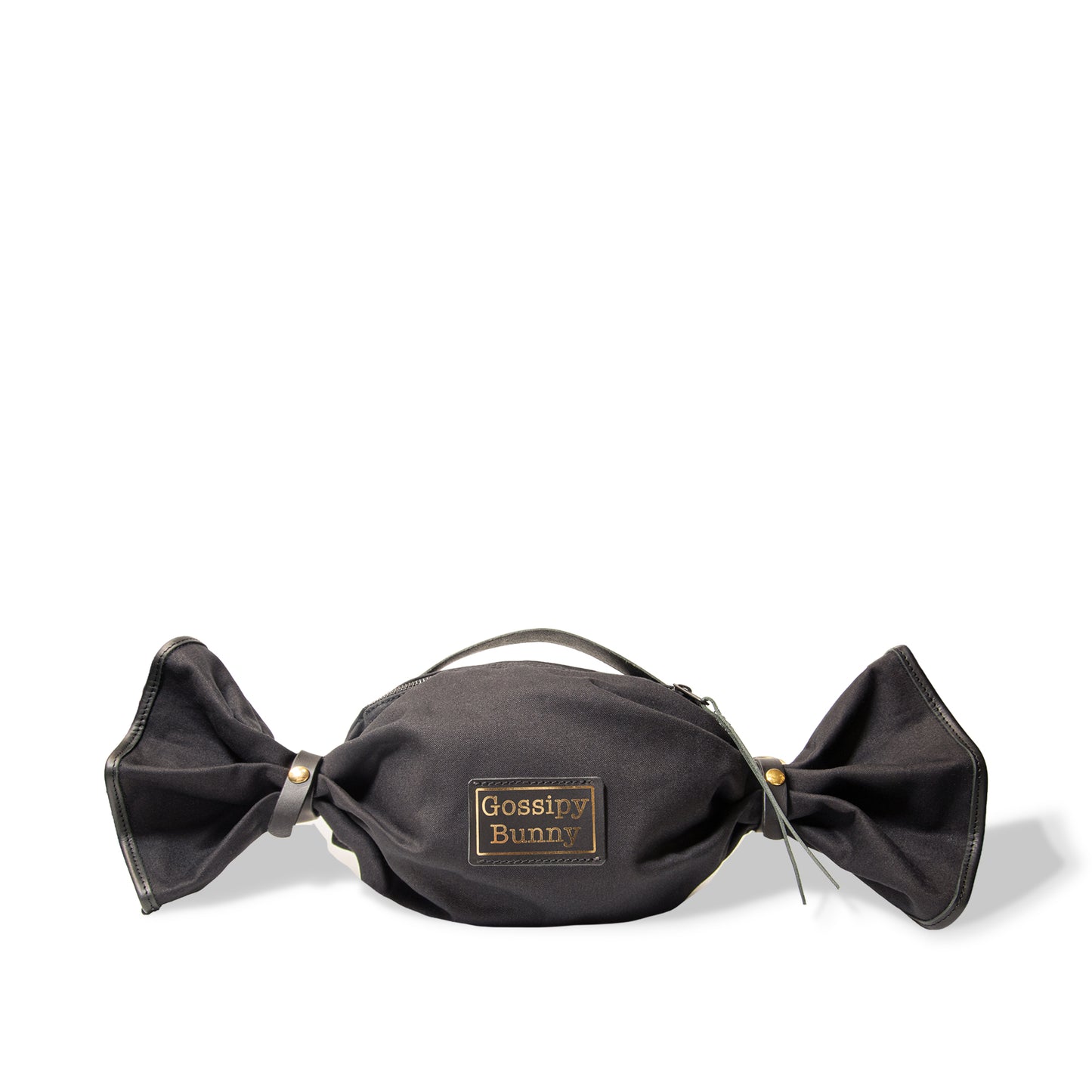 ROAVAN（ローバン） Gossipy Bunny（ゴシッピーバニー） Bonbon Lop（ボンボン・ロップ）のキャンディ形バッグ。岡山県倉敷産11号帆布と国産ブラックレザーを組み合わせ、両端をツイストして束ねた立体構造と真鍮金具、黒ファスナーを採用したショルダー兼ハンドバッグ。