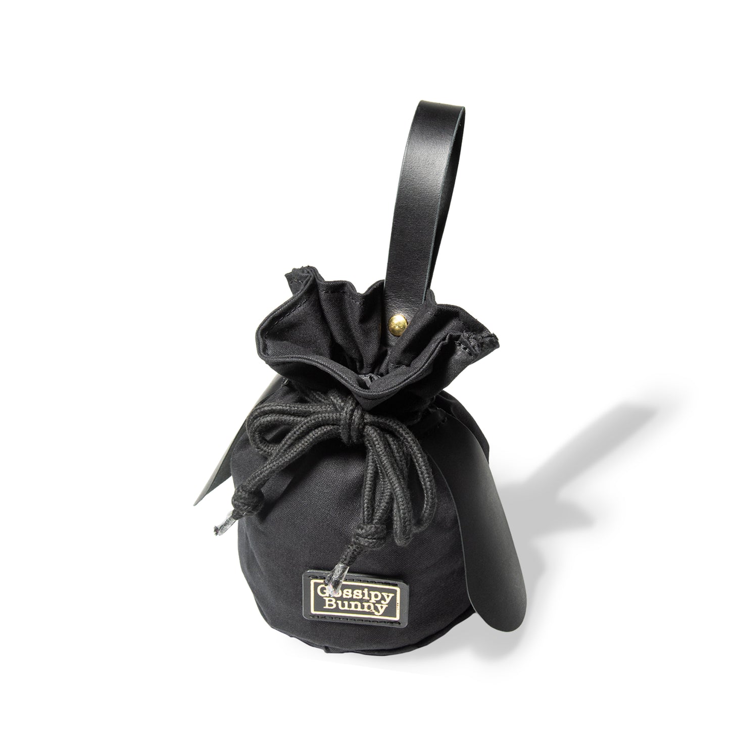 Roavan（ローバン） Gossipy Bunny（ゴシッピーバニー） Bunny Vup（バニーバップ） 巾着型ポーチ。倉敷帆布とブラックレザーの構成、丸底形状、SMロープ、本革ループハンドル、垂れ耳モチーフを特徴とする携行用小型ポーチ。