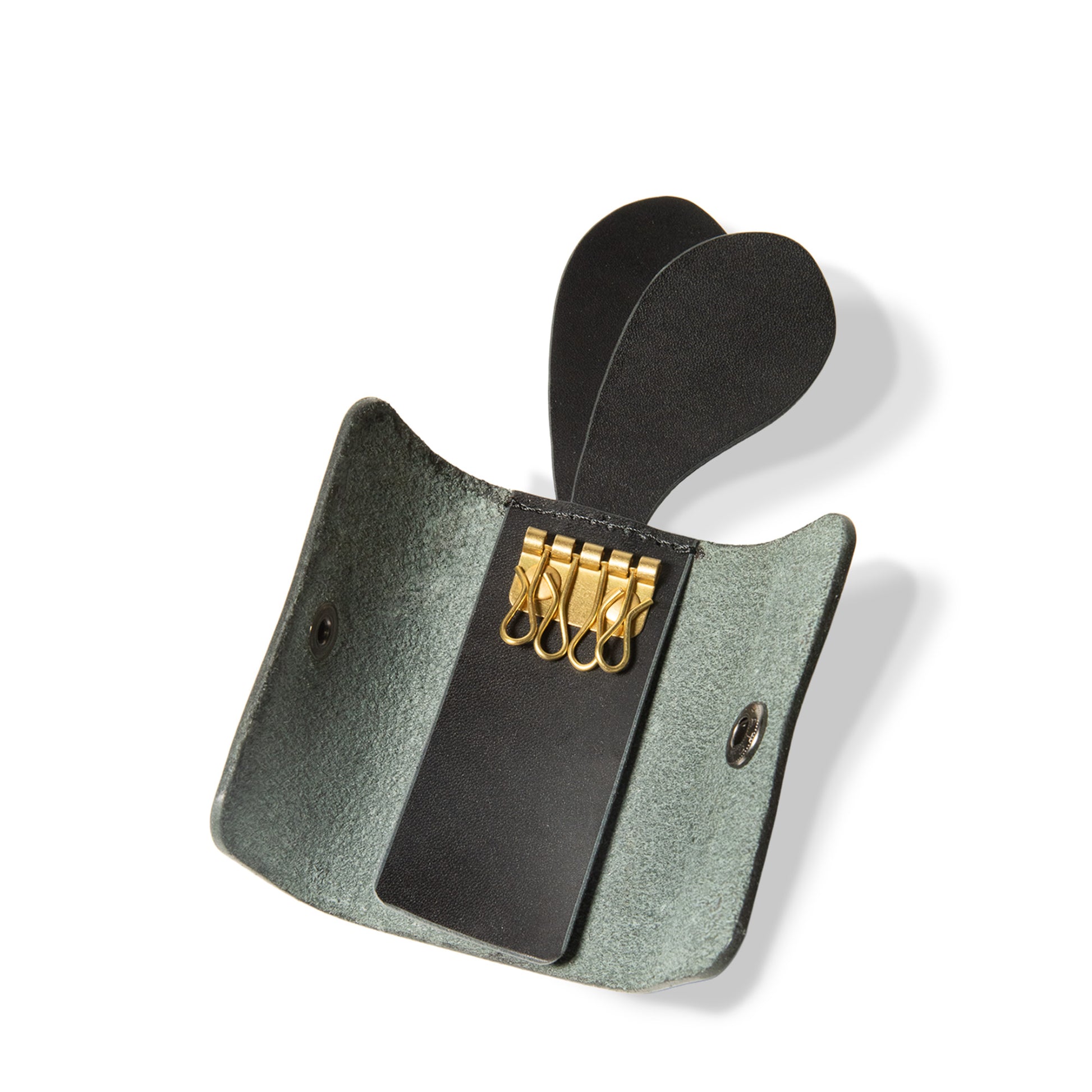 ROAVAN（ローバン） Gossipy Bunny（ゴシッピーバニー）の4連キーケース「Lapino（ラピーノ）」。日本製ブラックレザーと真鍮金具を使用し、ウサギの耳モチーフを備えた縦向きデザイン。本革の経年変化を楽しめる仕様。