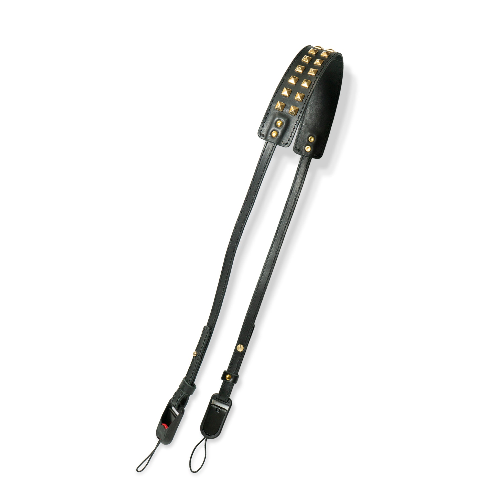 ROAVAN（ローバン） Gossipy Bunny（ゴシッピーバニー） Prick Dot（プリックドット） カメラストラップ。国産ブラックレザーを使用し、ゴールドカラーのピラミッド型スタッズを点在配置したデザイン。アンカーリンクスによるワンタッチ着脱と、首への負担を軽減する幅広ネック構造が特徴。