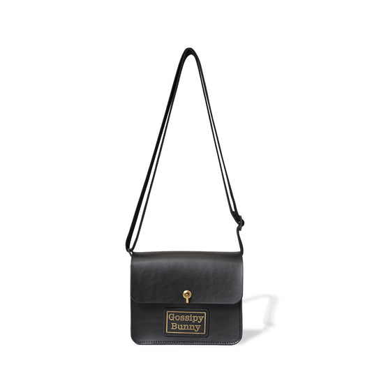 Roavan（ローバン） Gossipy Bunny（ゴシッピーバニー） Toy Box（トイボックス） ショルダーバッグ。国産ブラックレザーを使用した箱型一室構造で、真鍮製はとめ起こしによる片手開閉が可能な、散歩や日常の外出向けレザーバッグ。