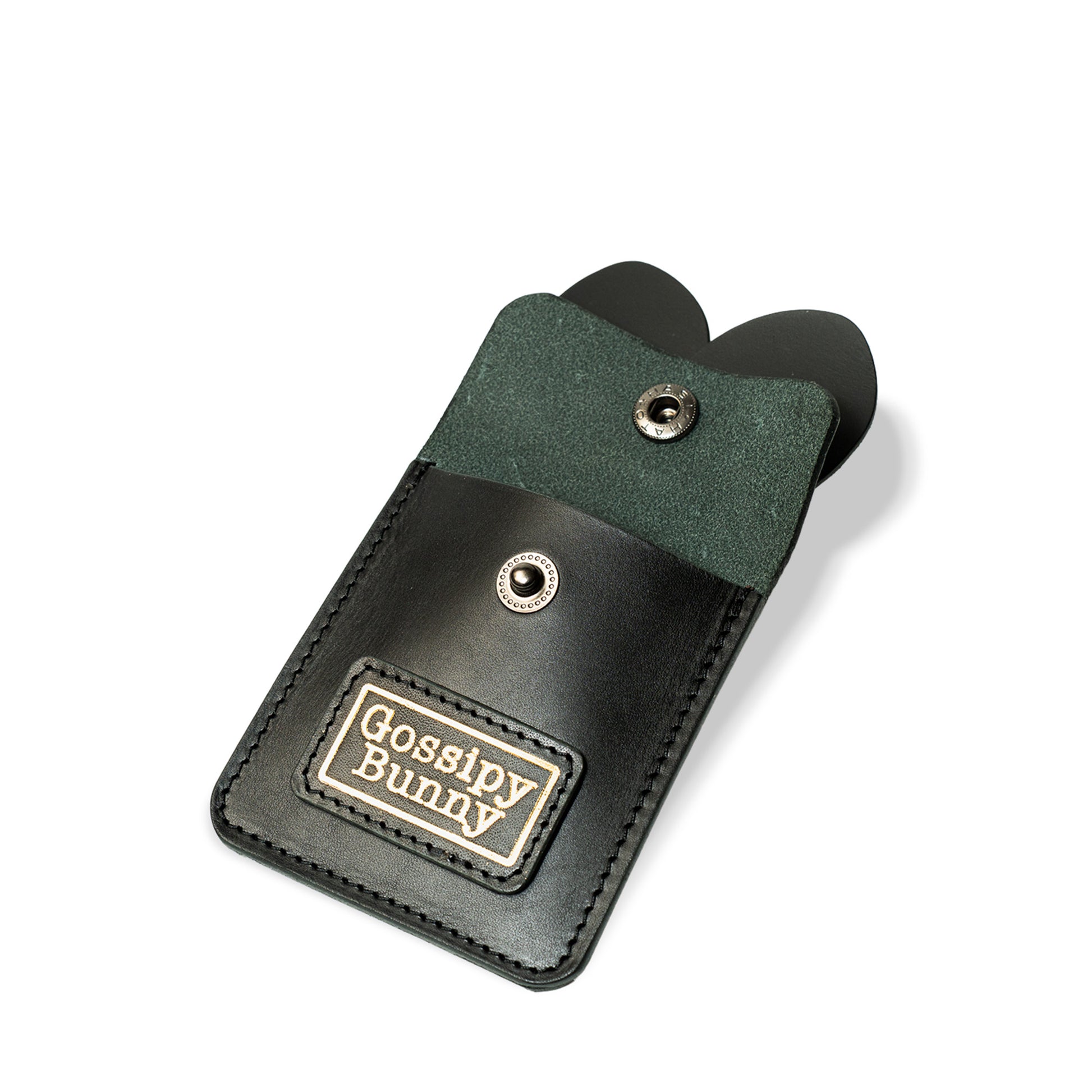 Roavan（ローバン） Gossipy Bunny（ゴシッピーバニー） ニコチン主義（ニコチンシュギ） 携帯灰皿（モバイル灰皿）。黒の牛革を使用し、市販インナー交換に対応した携帯灰皿で、ゴールド箔押しロゴの革パッチとウサギ耳パーツを組み合わせたデザイン。